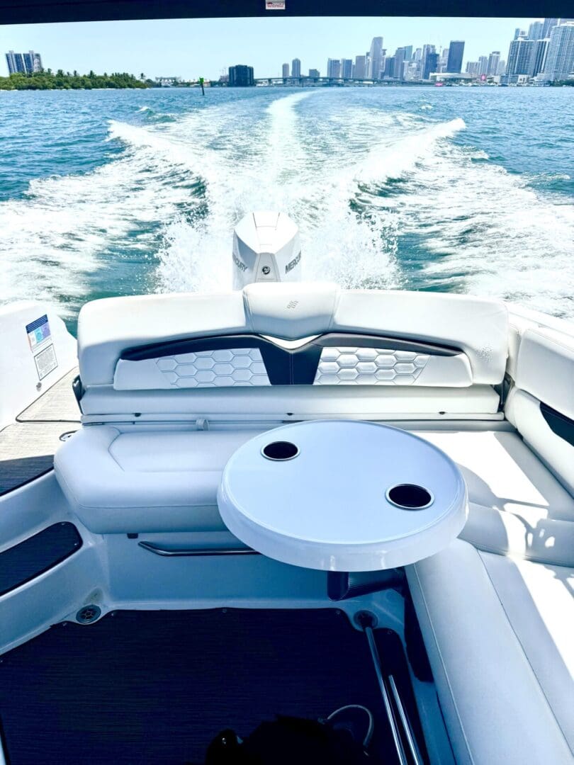 Boat interior with ocean view and skyline.