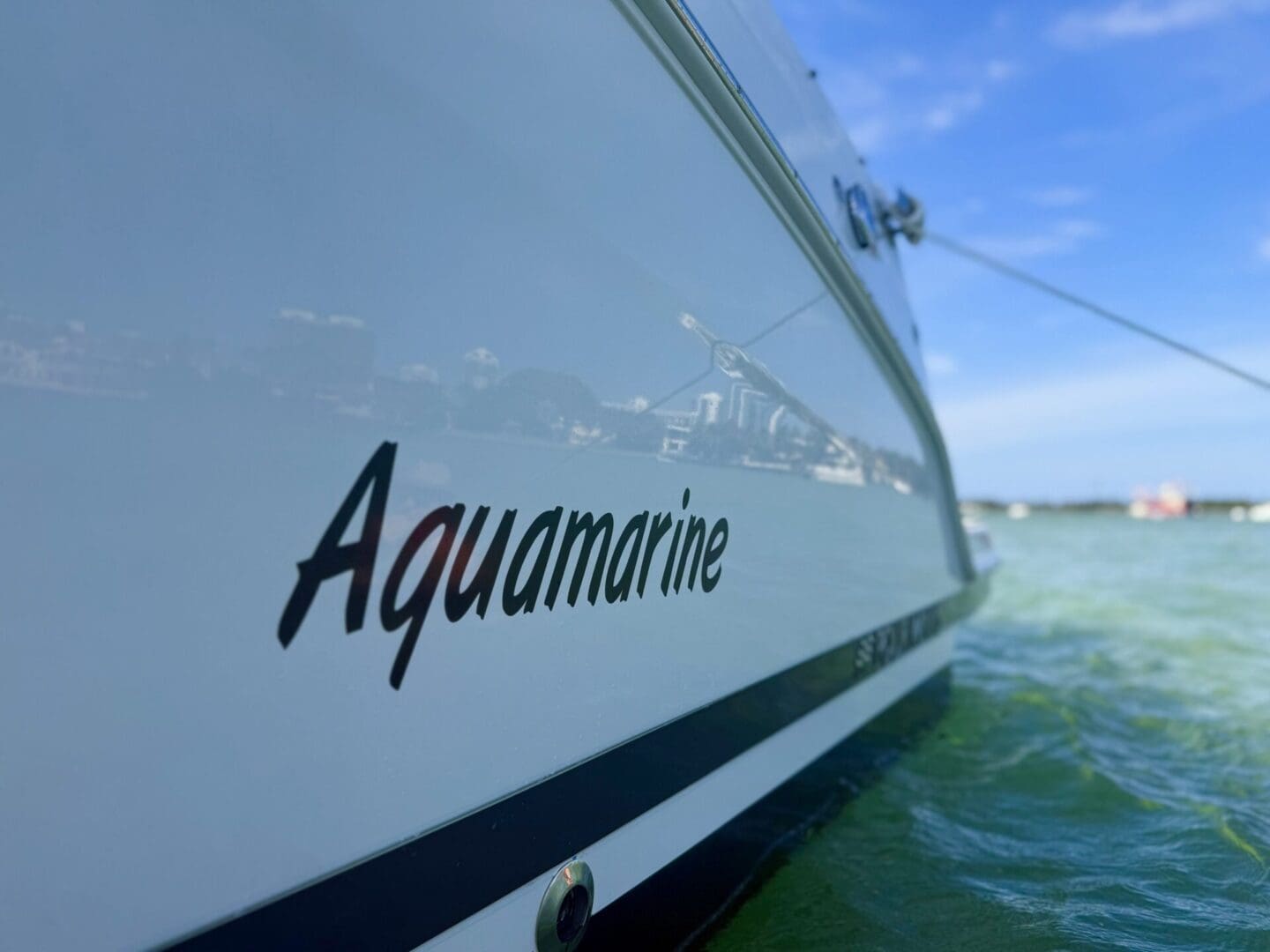 Close up of a boat named Aquamarine.